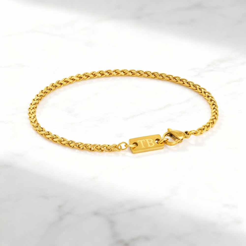 pulseira-homem-fina-dourada-entrelacada Pulseira para homem em aço dourado fina.