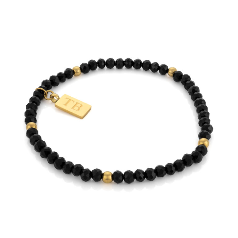 Pulseira Homem Dourada Brickel, elástica com pedras naturais pretas e aço inoxidável, ajustável ao pulso masculino da Twobrothers.